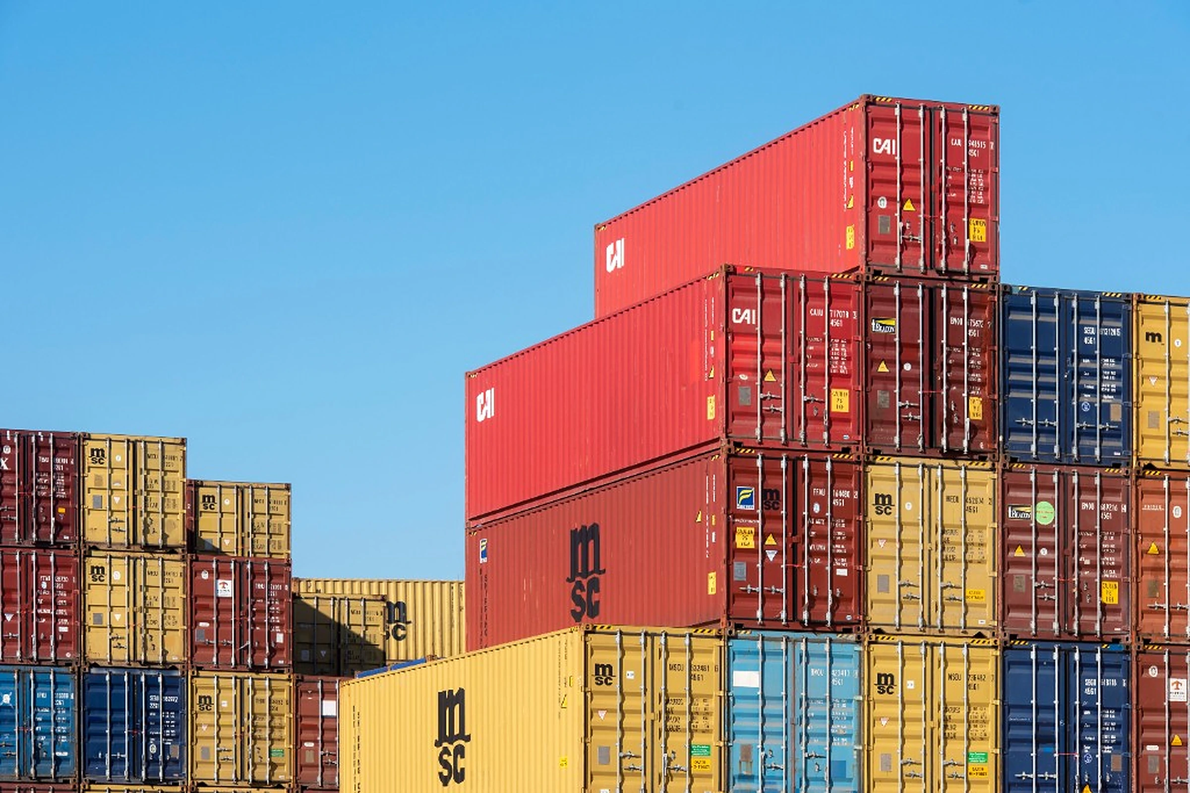 Stacked shipping containers ready for import clearance